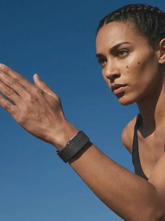 Athletic woman wearing Hume Band outdoors — building metabolic momentum